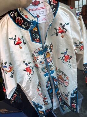 Asian theme shirt jacket.  Cream, blue ,red, with embroidery.  Perfect condition